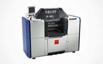 Compact laboratory mixing mill with rollers, control panel, and central feed area.