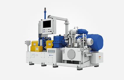Laboratory mixers with control panel, blue units, and complex hydraulic assemblies.