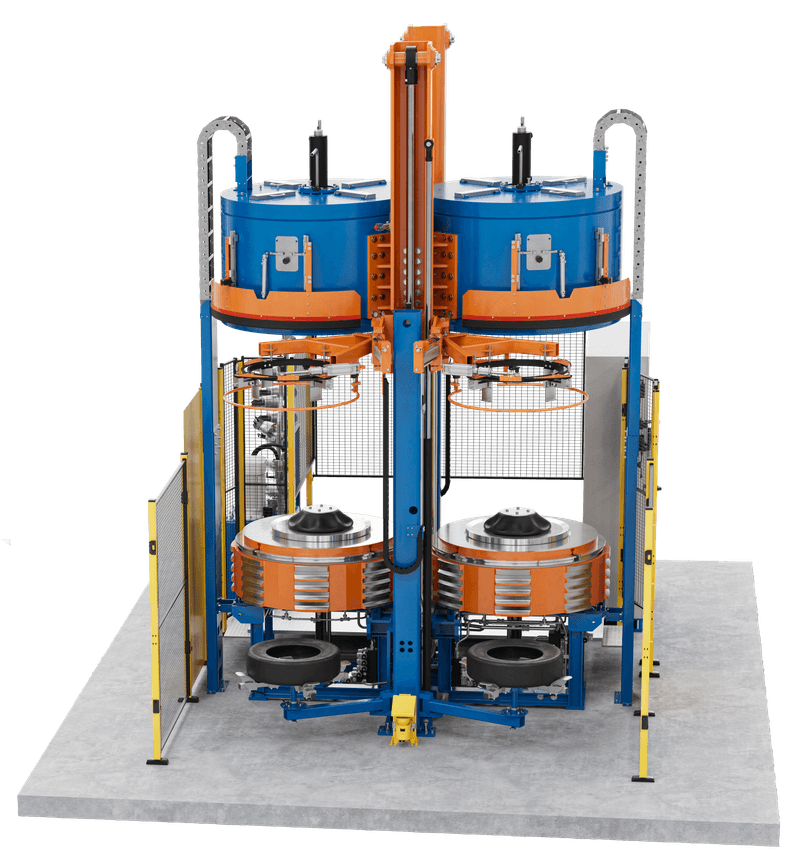 Large blue and orange tyre curing press with multiple round stations and frame.