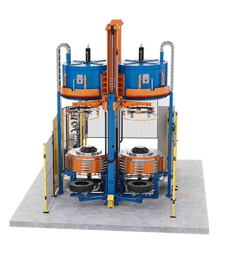 Large blue and orange tyre curing press with multiple round stations and frame.