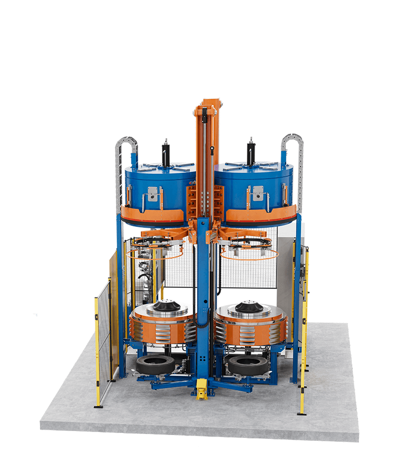 Large blue and orange tyre curing press with multiple round stations and frame.
