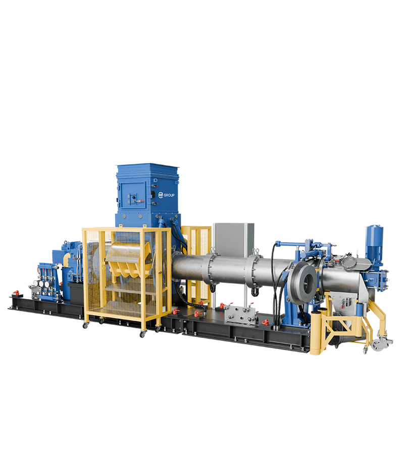 Long single-screw extruder with large cylindrical housing, yellow safety guards, and blue units.