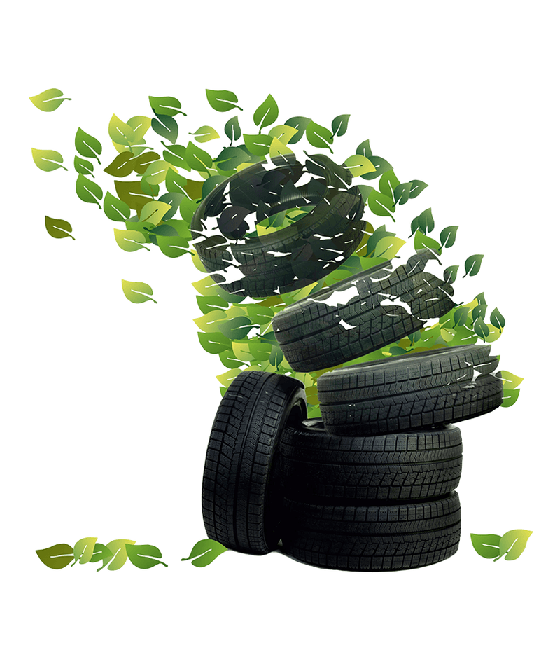 Stack of tyres dissolving into green leaves.