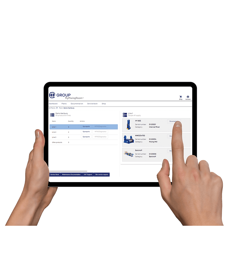 Tablet with software interface open, held and operated by two hands.