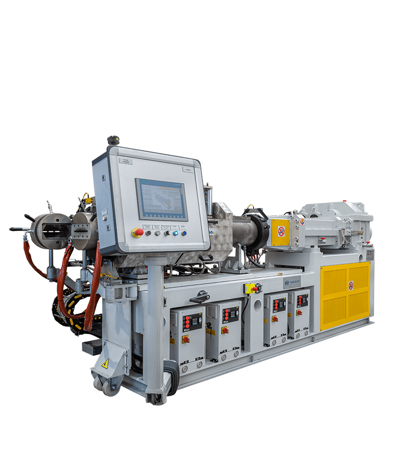 Strainer-Extruder with large control panel, pipe assembly, yellow guards, and cabling.